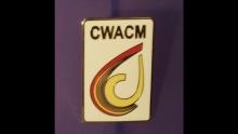 Small rectangle pin with white background and multi-color CWACM logo