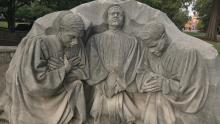 tone sculpture of clergy praying in Birmingham, Alabama.