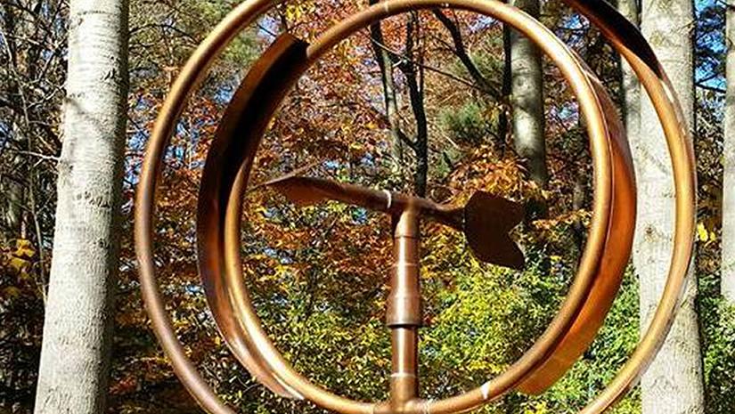 outdoor sculpture with rings and arrow